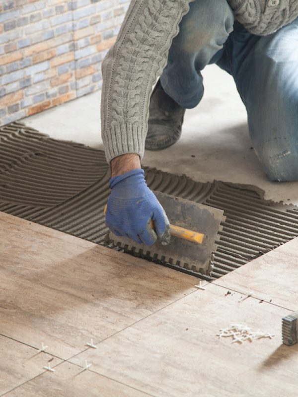 Laying floor ceramic tile. Renovating the floor